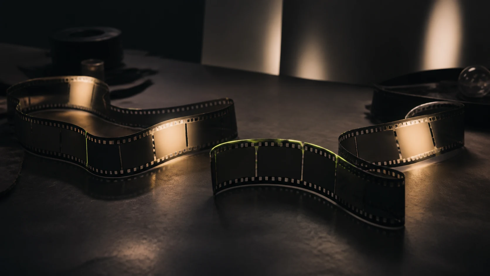 A long film strip with selected frames illuminated